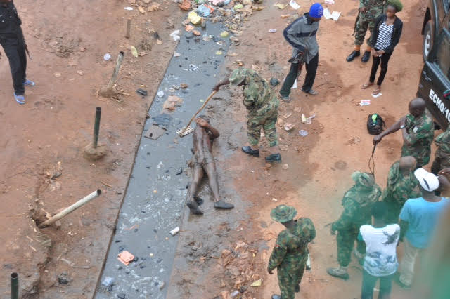Soldiers punishing a civilian